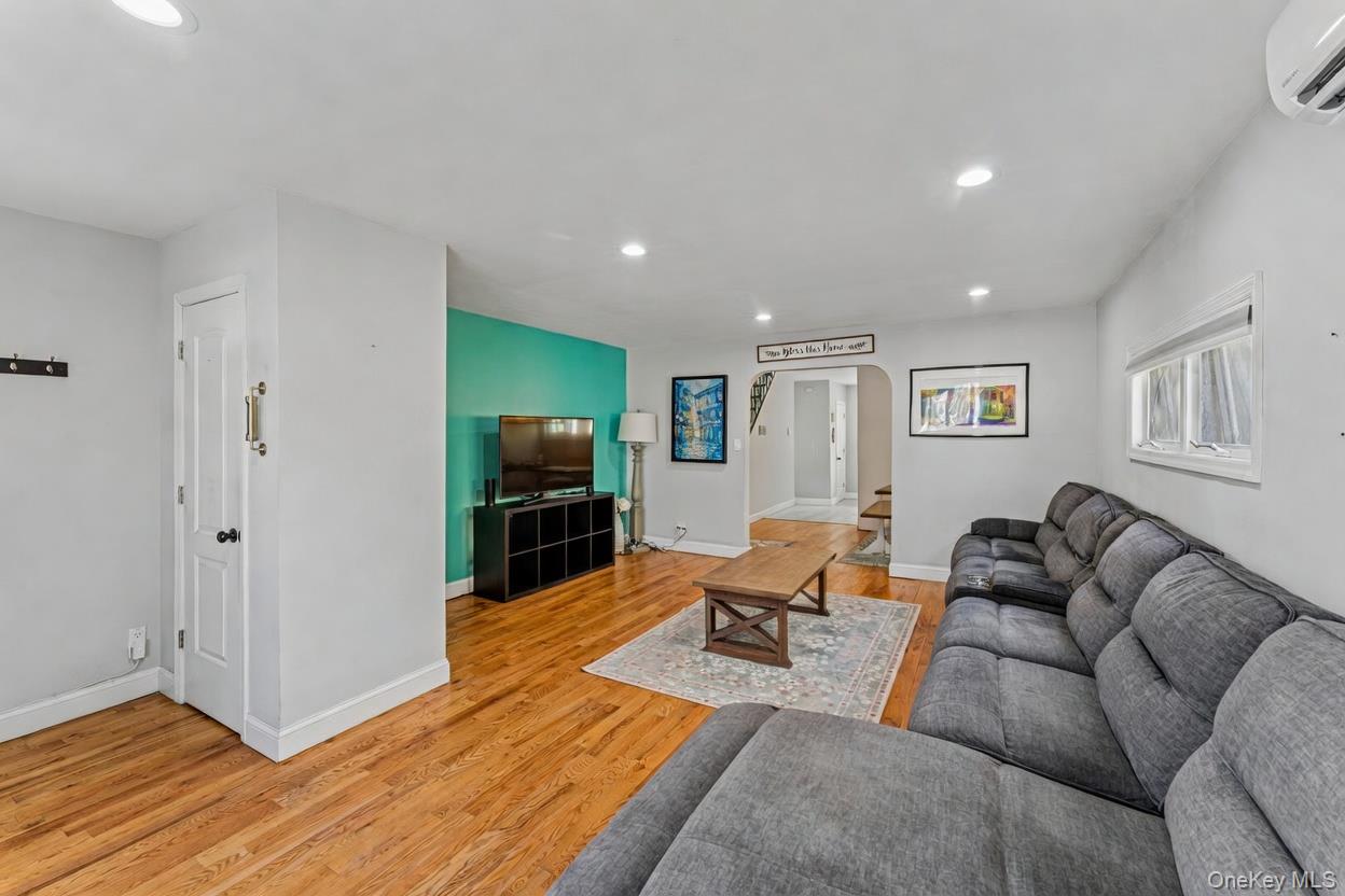 68 Putnam Avenue Valley Stream, NY 11580 - Photo 1 of 23 a living room with furniture and a flat screen tv