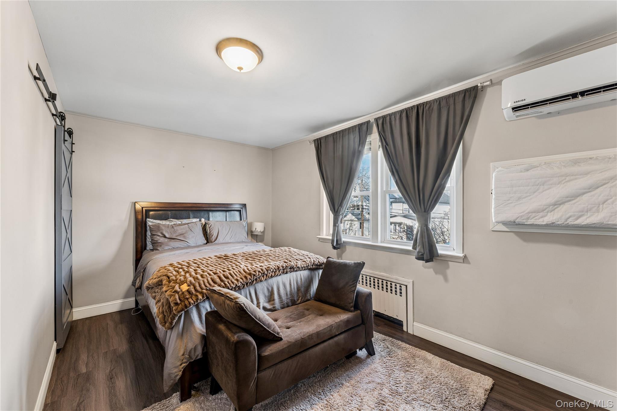 68 Putnam Avenue Valley Stream, NY 11580 - Photo 12 of 23 a bedroom with a bed and window