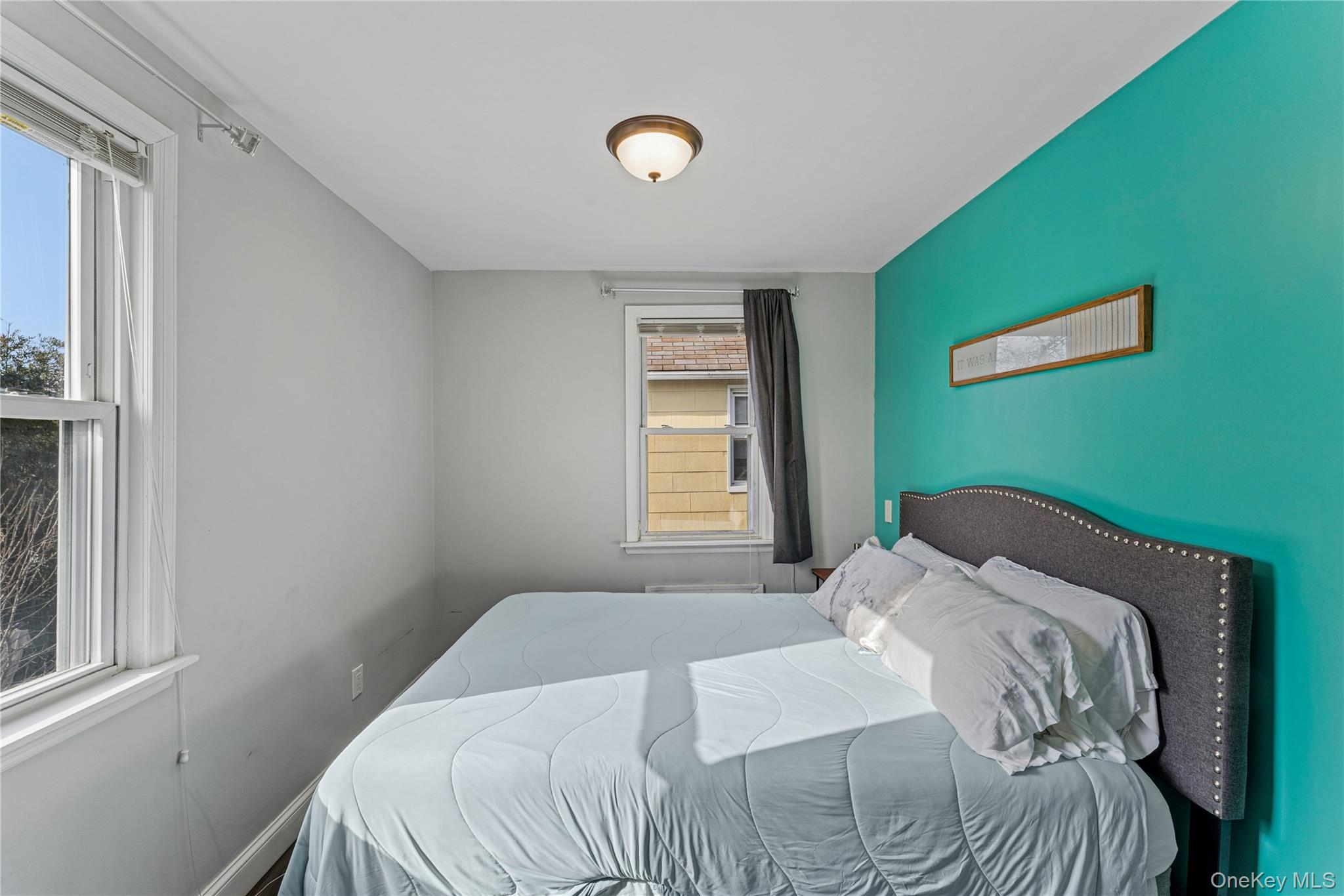 68 Putnam Avenue Valley Stream, NY 11580 - Photo 15 of 23 a bedroom with a bed and a window
