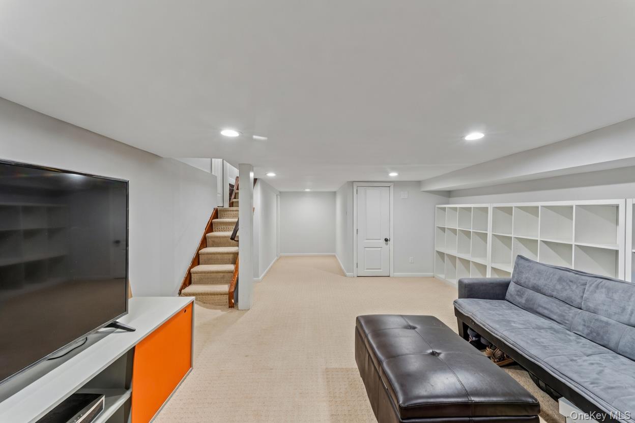 68 Putnam Avenue Valley Stream, NY 11580 - Photo 16 of 23 a living room with furniture and wooden floor