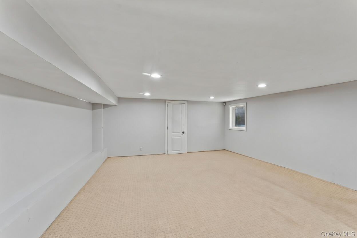 68 Putnam Avenue Valley Stream, NY 11580 - Photo 17 of 23 an empty room with a empty space and windows