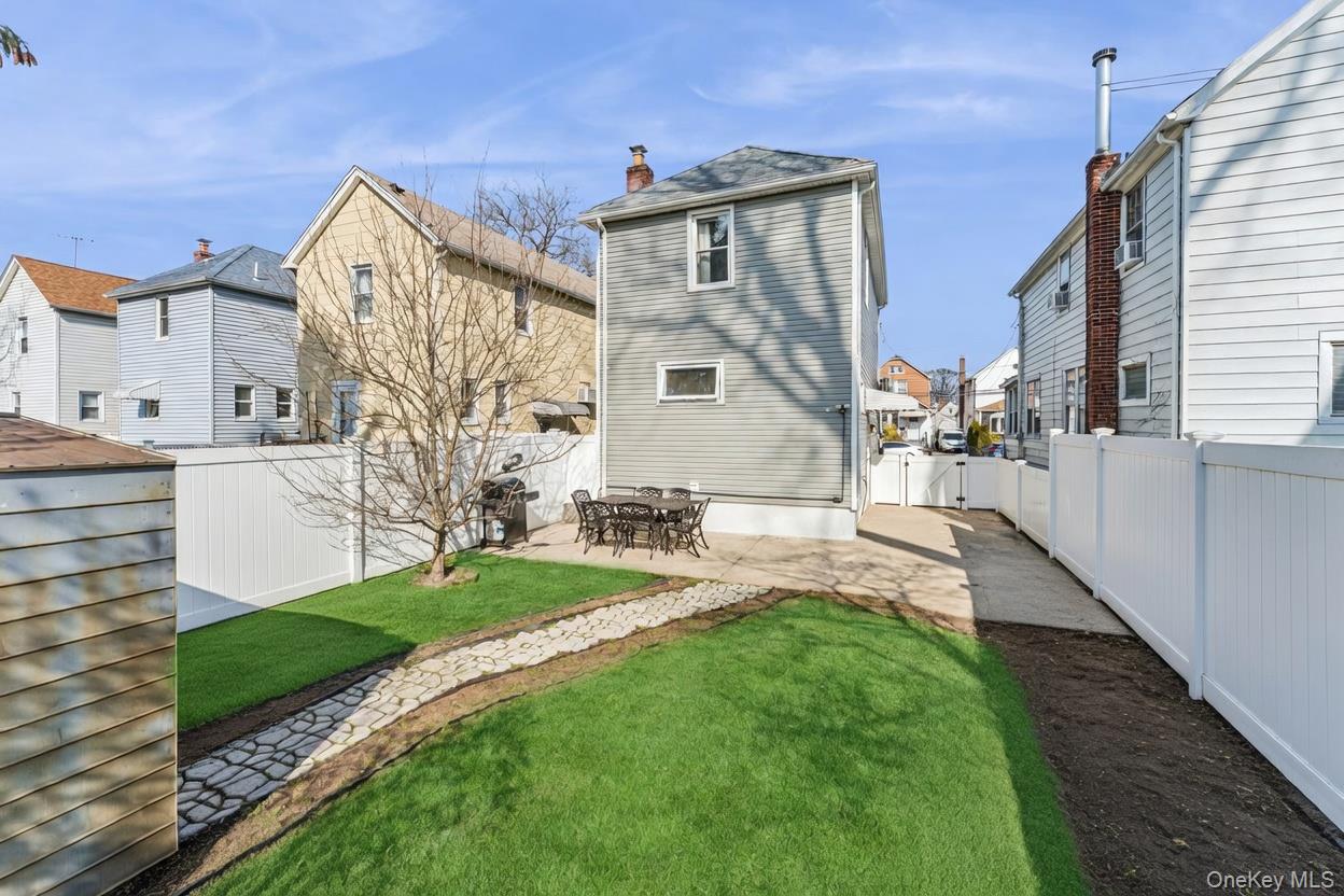 68 Putnam Avenue Valley Stream, NY 11580 - Photo 19 of 23 a view of a front of a house with a yard