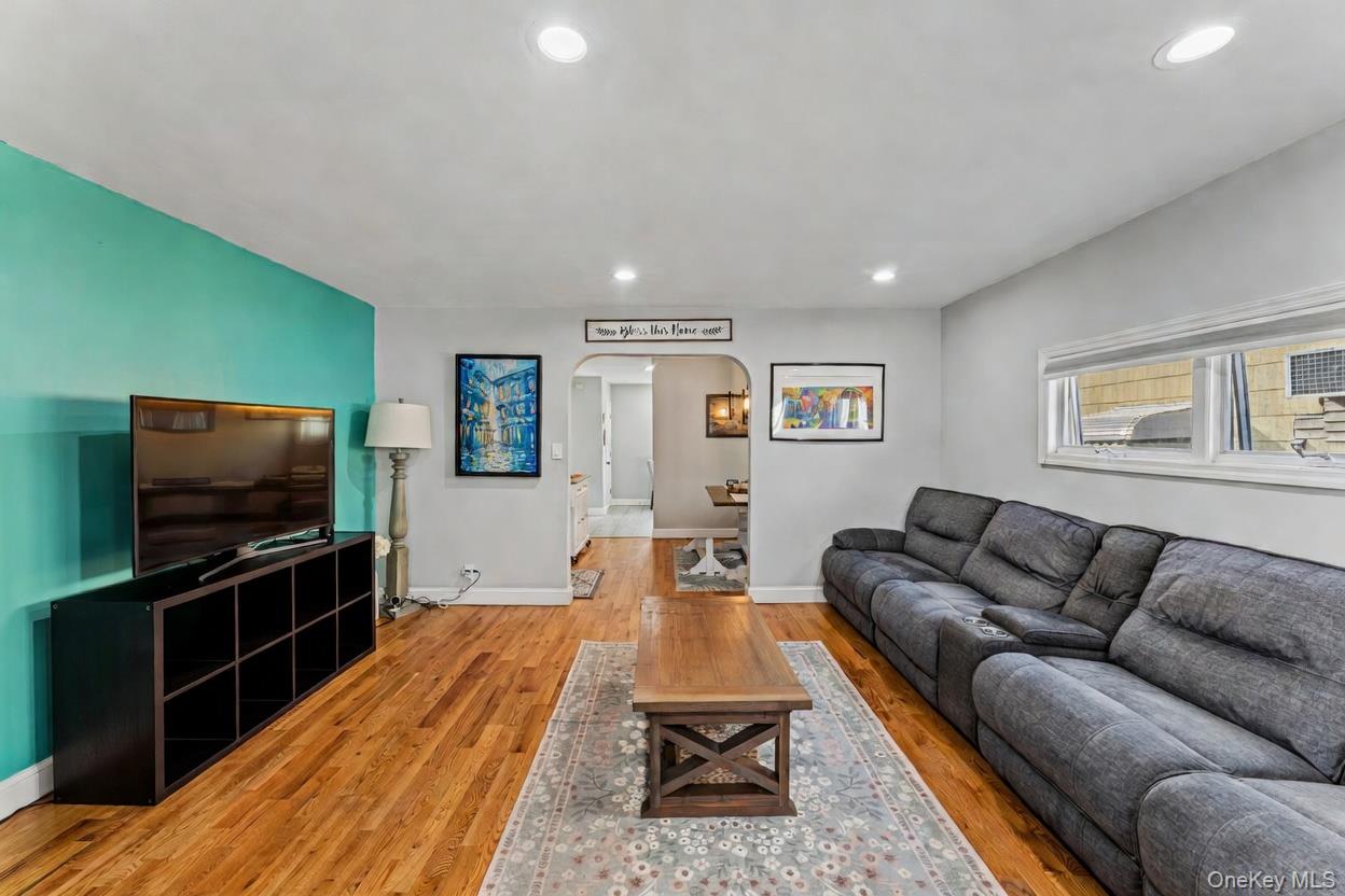 68 Putnam Avenue Valley Stream, NY 11580 - Photo 2 of 23 a living room with furniture and a flat screen tv