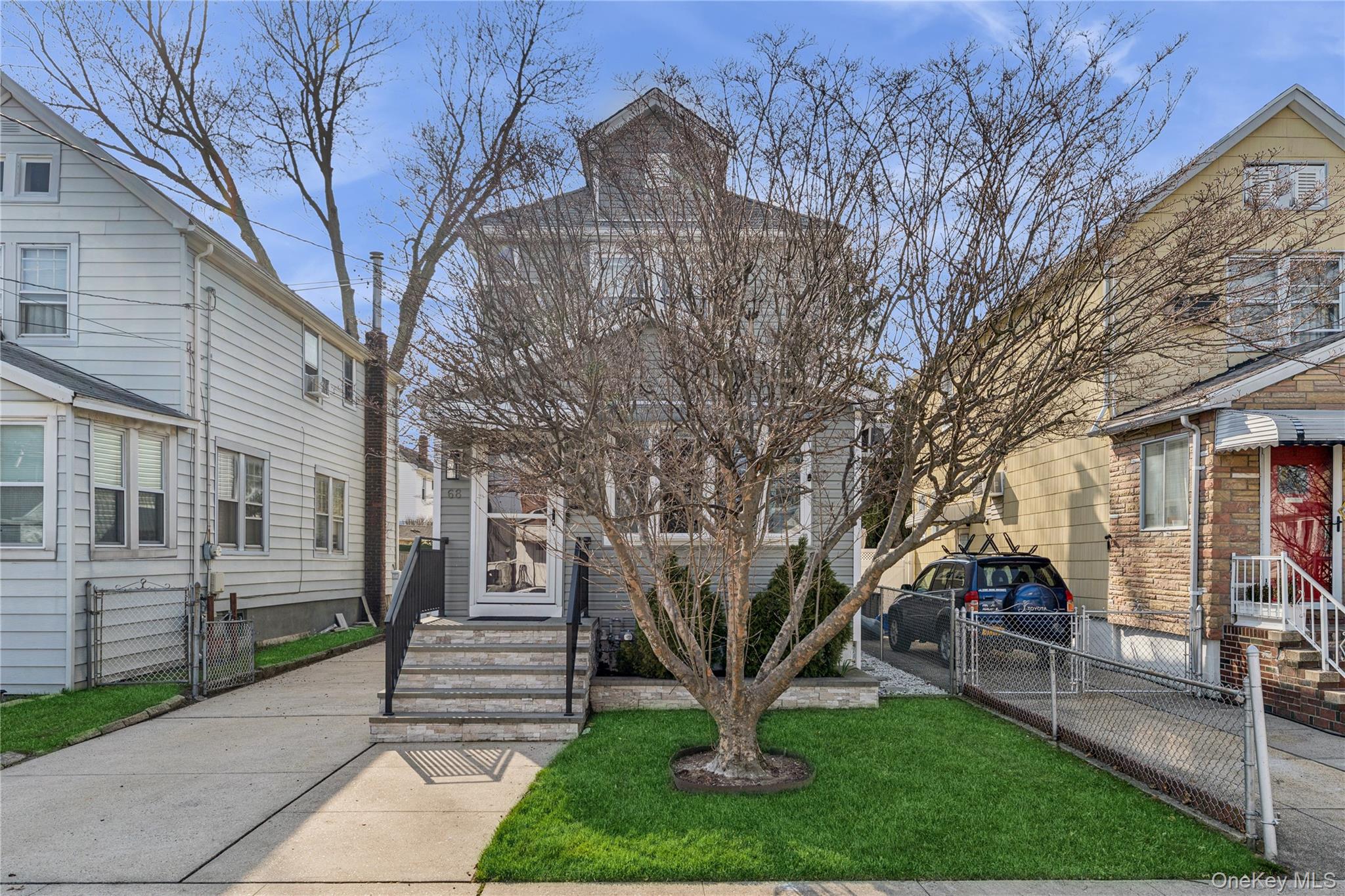 68 Putnam Avenue Valley Stream, NY 11580 - Photo 21 of 23 a front view of a house with garden and trees