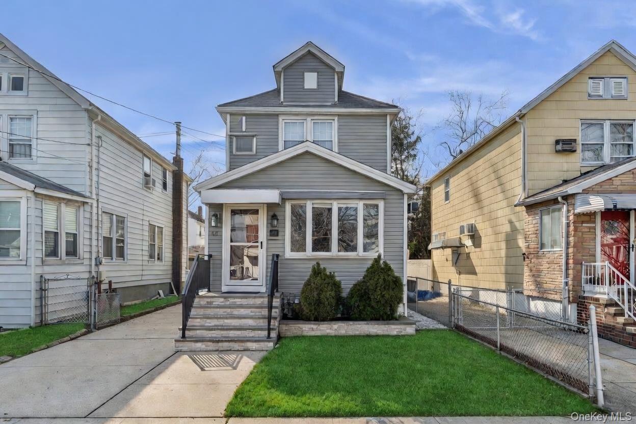 68 Putnam Avenue Valley Stream, NY 11580 - Photo 22 of 23 a front view of a house with a yard