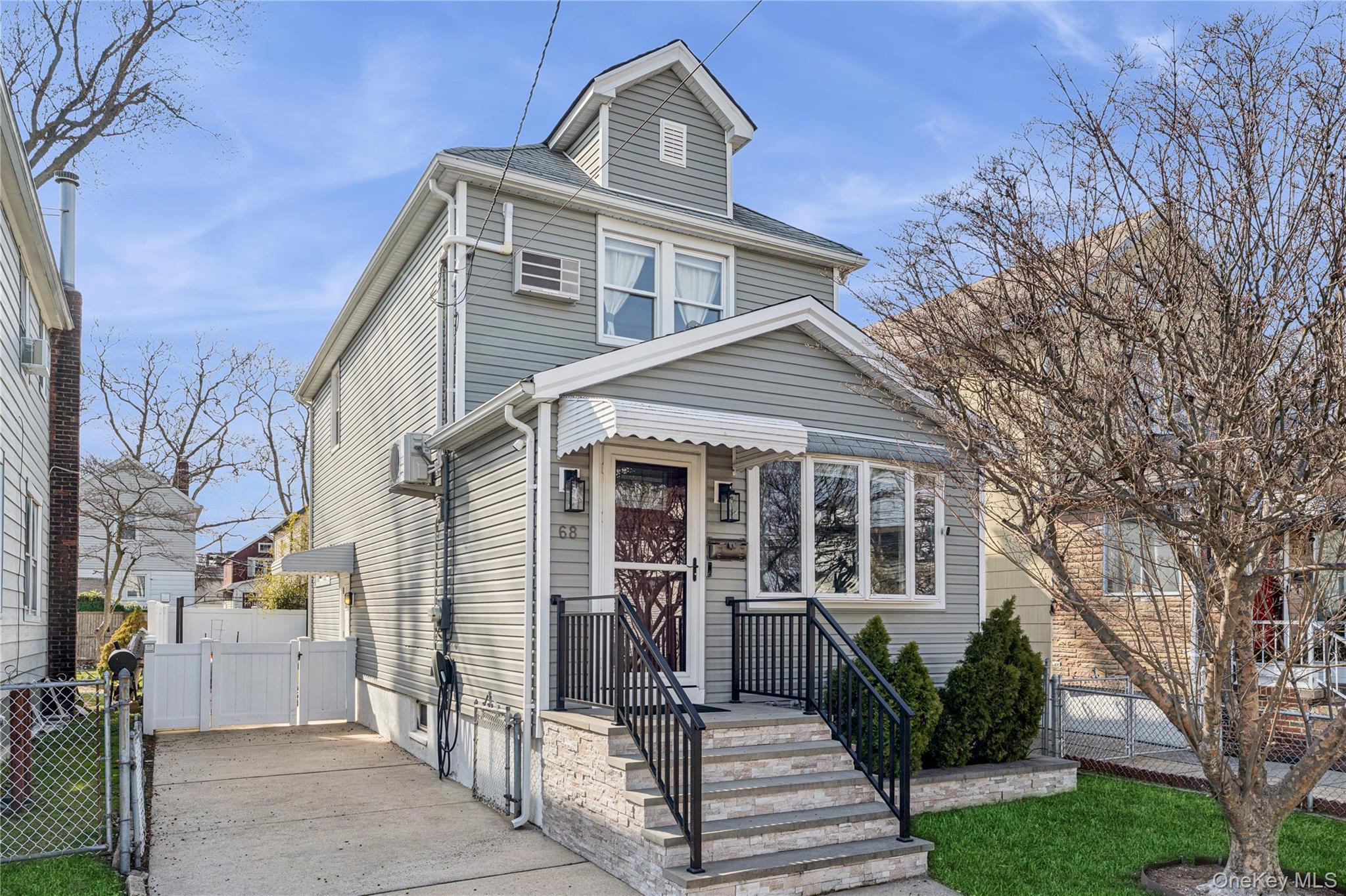 68 Putnam Avenue Valley Stream, NY 11580 - Photo 23 of 23 a front view of a house with a glass windows