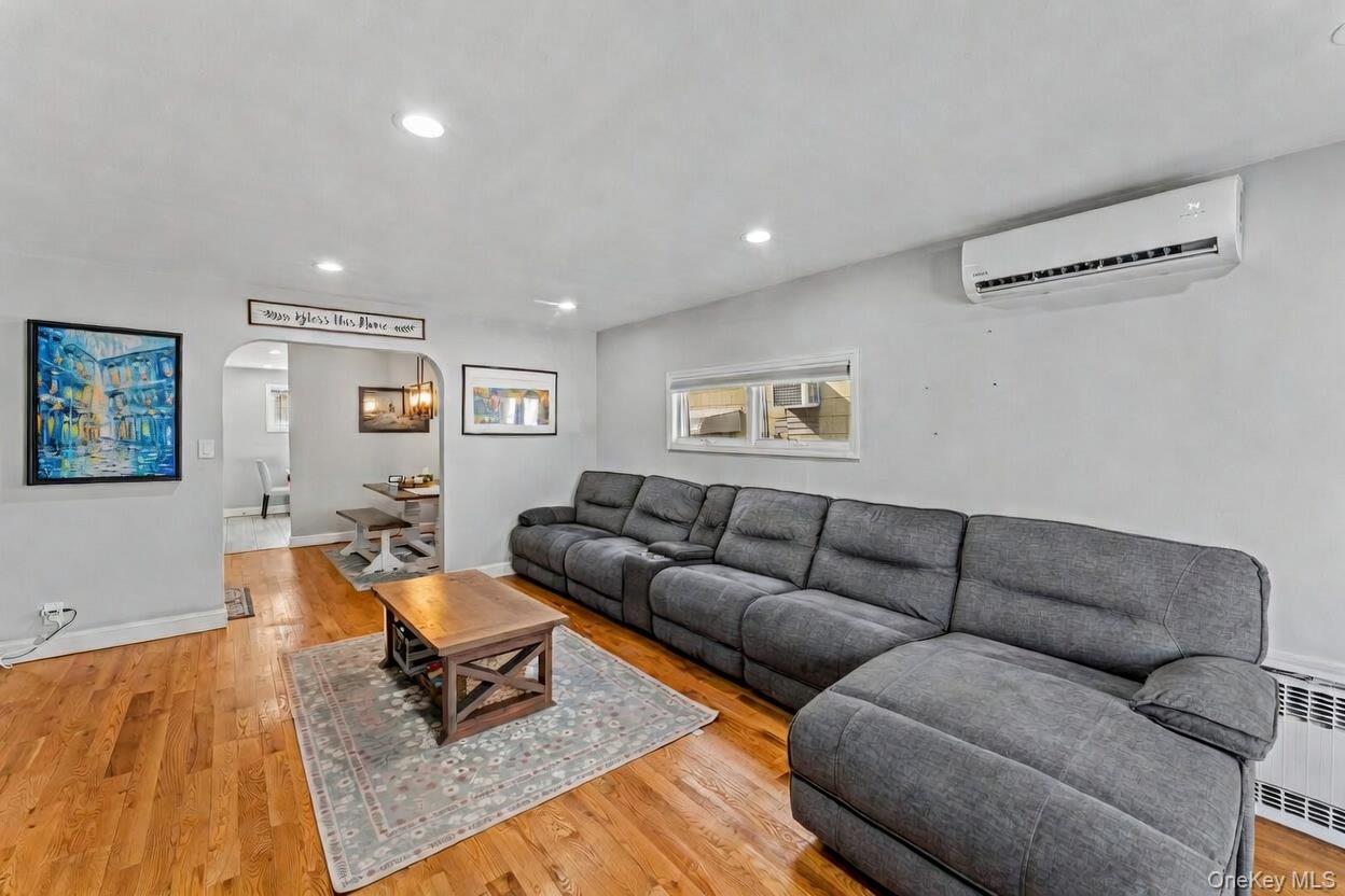 68 Putnam Avenue Valley Stream, NY 11580 - Photo 3 of 23 a living room with furniture and a couch