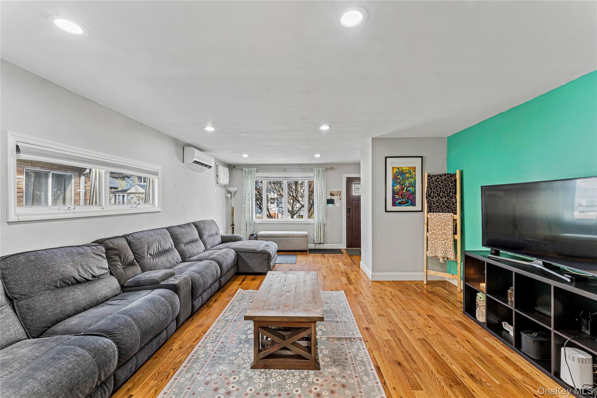 68 Putnam Avenue Valley Stream, NY 11580 - Photo 4 of 23 a living room with furniture and a flat screen tv