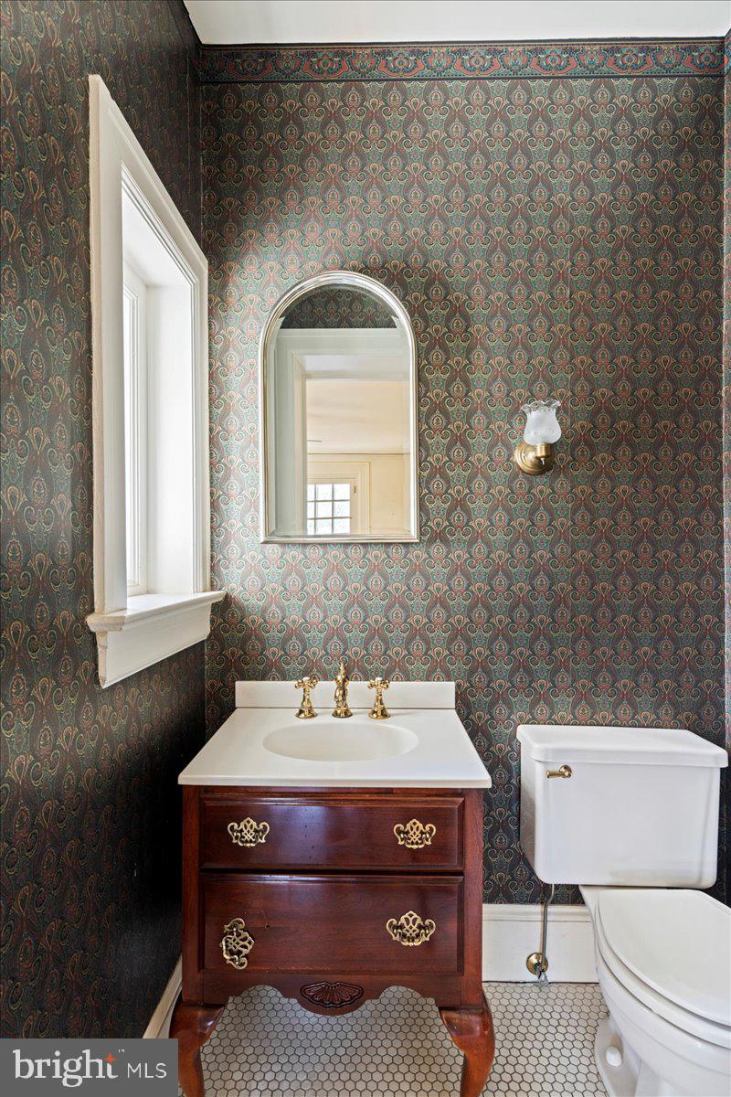 2185 South Easton Road Doylestown, PA 18901 - Photo 46 of 62 a bathroom with a toilet a sink and mirror