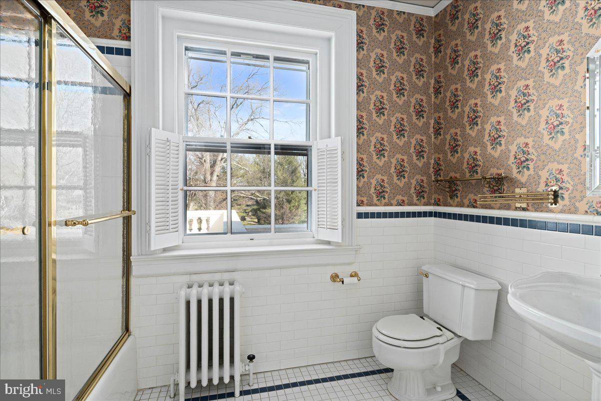 2185 South Easton Road Doylestown, PA 18901 - Photo 48 of 62 a bathroom with a toilet a sink and a window