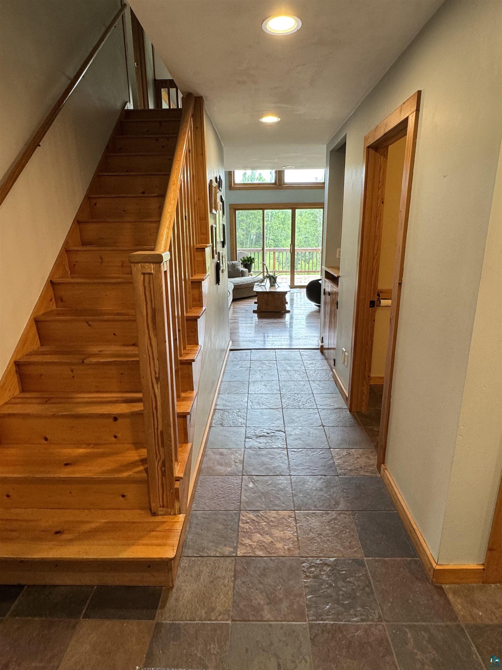 1745 Becks Road Maple, WI 54854 - Photo 10 of 46 Multi-toned slate-style tile flooring extending through the entry corridor