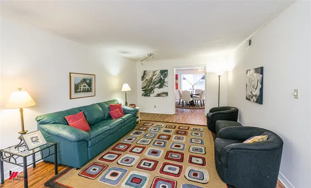 a living room with furniture and a rug