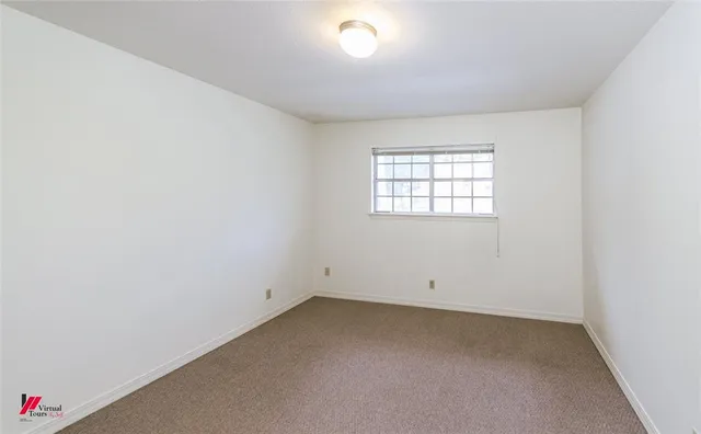 a kitchen with stainless steel appliances a stove and cabinets