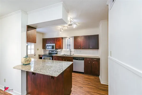 a kitchen with a sink and cabinets