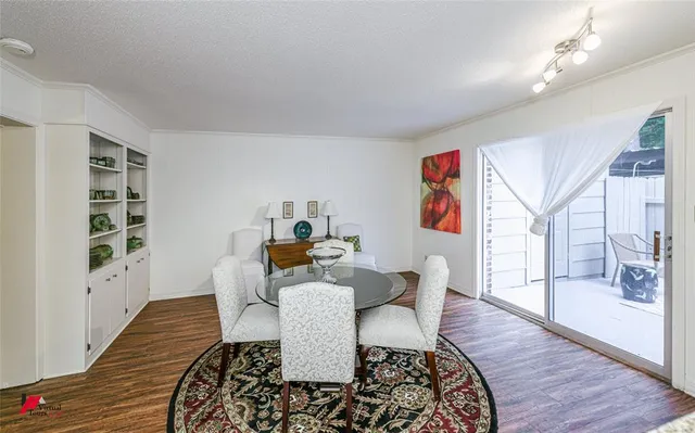 a living room with furniture and a book shelf