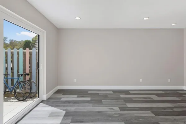 a room with a bed and a large window