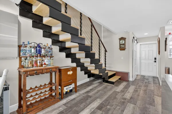 a view of entryway with wooden floor