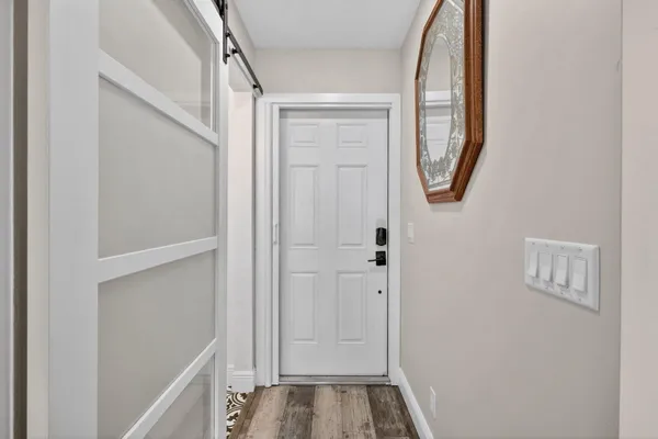 a white toilet sitting next to a white sink