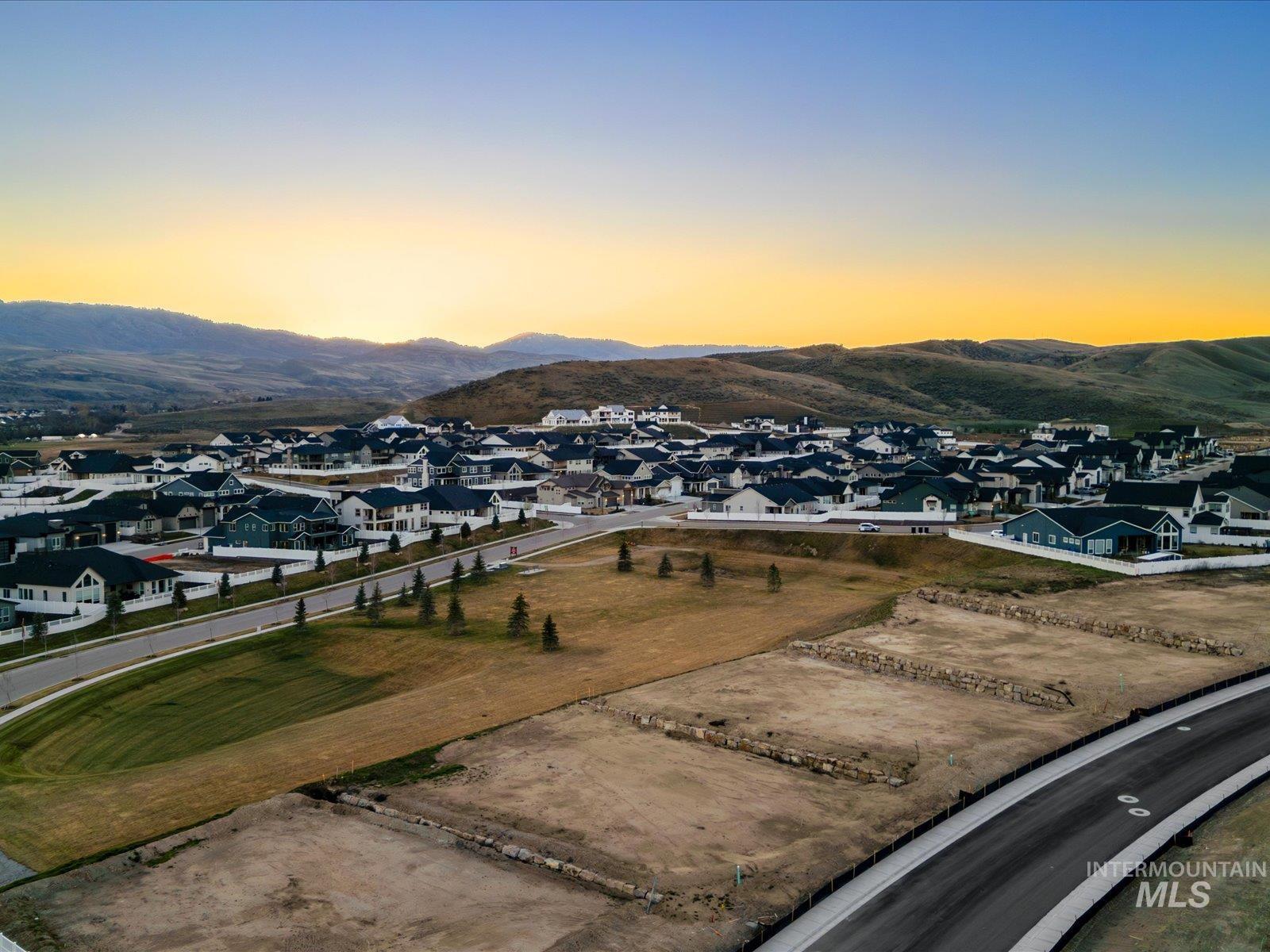 13592 North Farmstead Way Boise, ID 83714 - Photo 3 of 20 Aerial view at dusk of a residential view and a mountain view