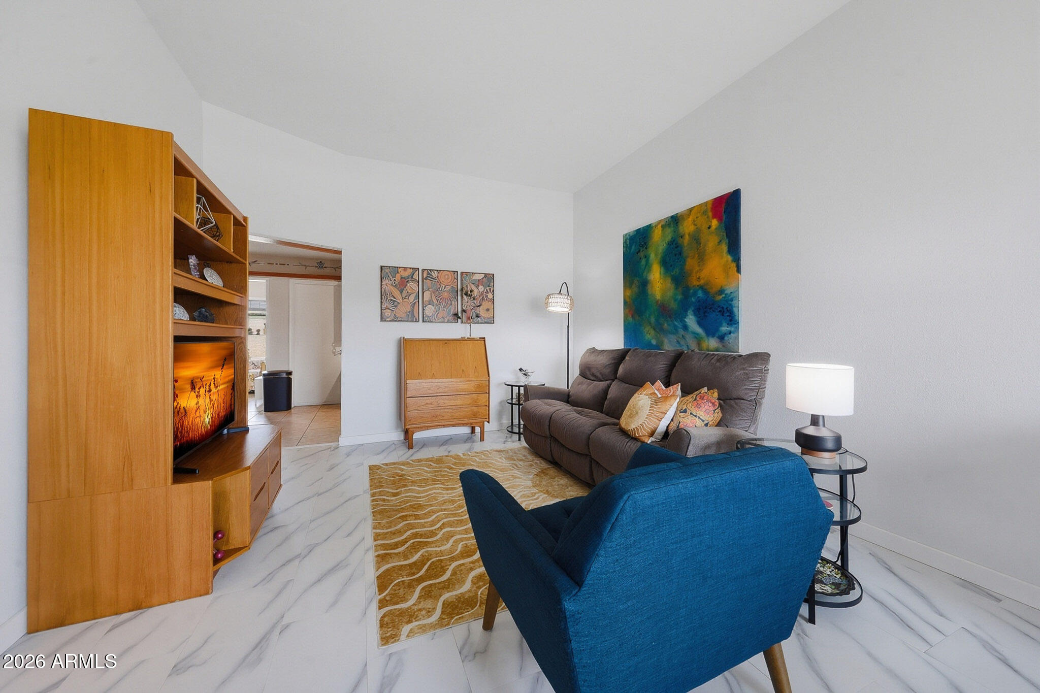 9970 West Royal Oak Road, Unit Q Sun City, AZ 85351 - Photo 15 of 38 a living room with furniture and a flat screen tv
