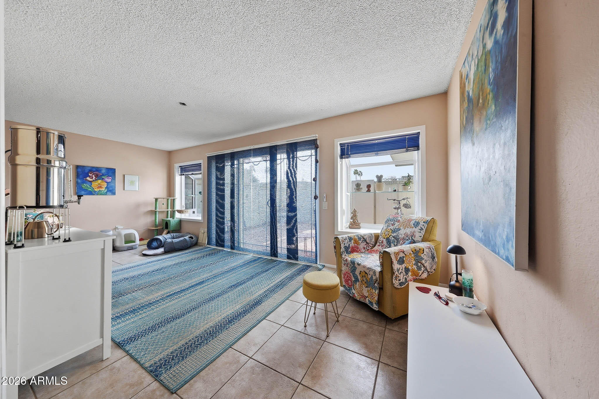 9970 West Royal Oak Road, Unit Q Sun City, AZ 85351 - Photo 25 of 38 a living room with furniture and large windows