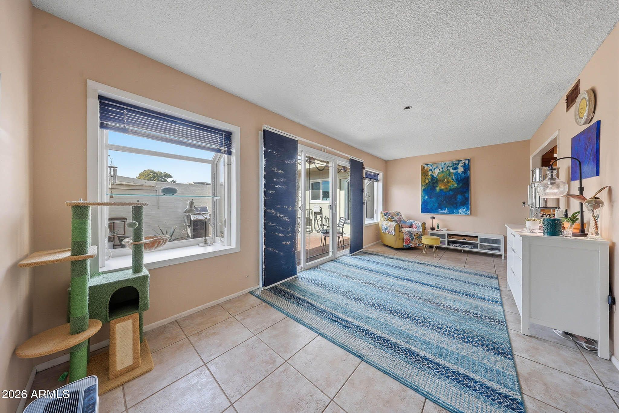 9970 West Royal Oak Road, Unit Q Sun City, AZ 85351 - Photo 26 of 38 a room with furniture and a window