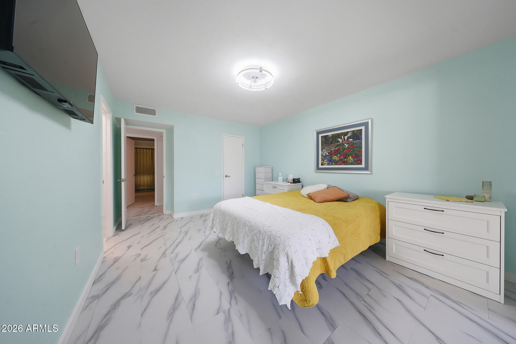 9970 West Royal Oak Road, Unit Q Sun City, AZ 85351 - Photo 28 of 38 a bed room with a bed and a window