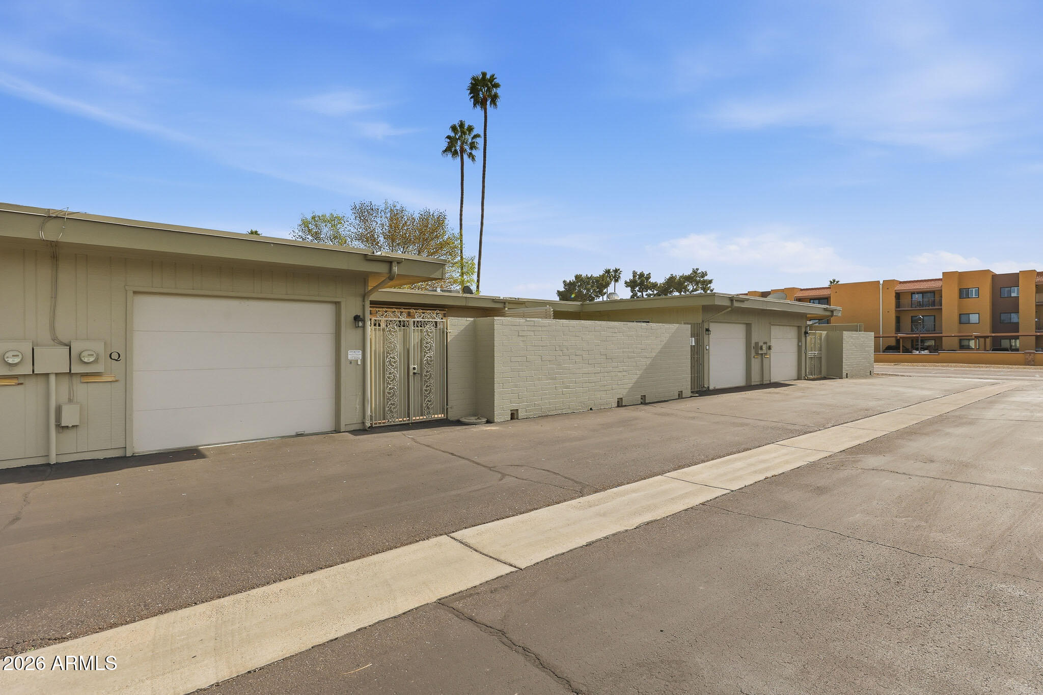 9970 West Royal Oak Road, Unit Q Sun City, AZ 85351 - Photo 36 of 38 a view of a terrace with a bench
