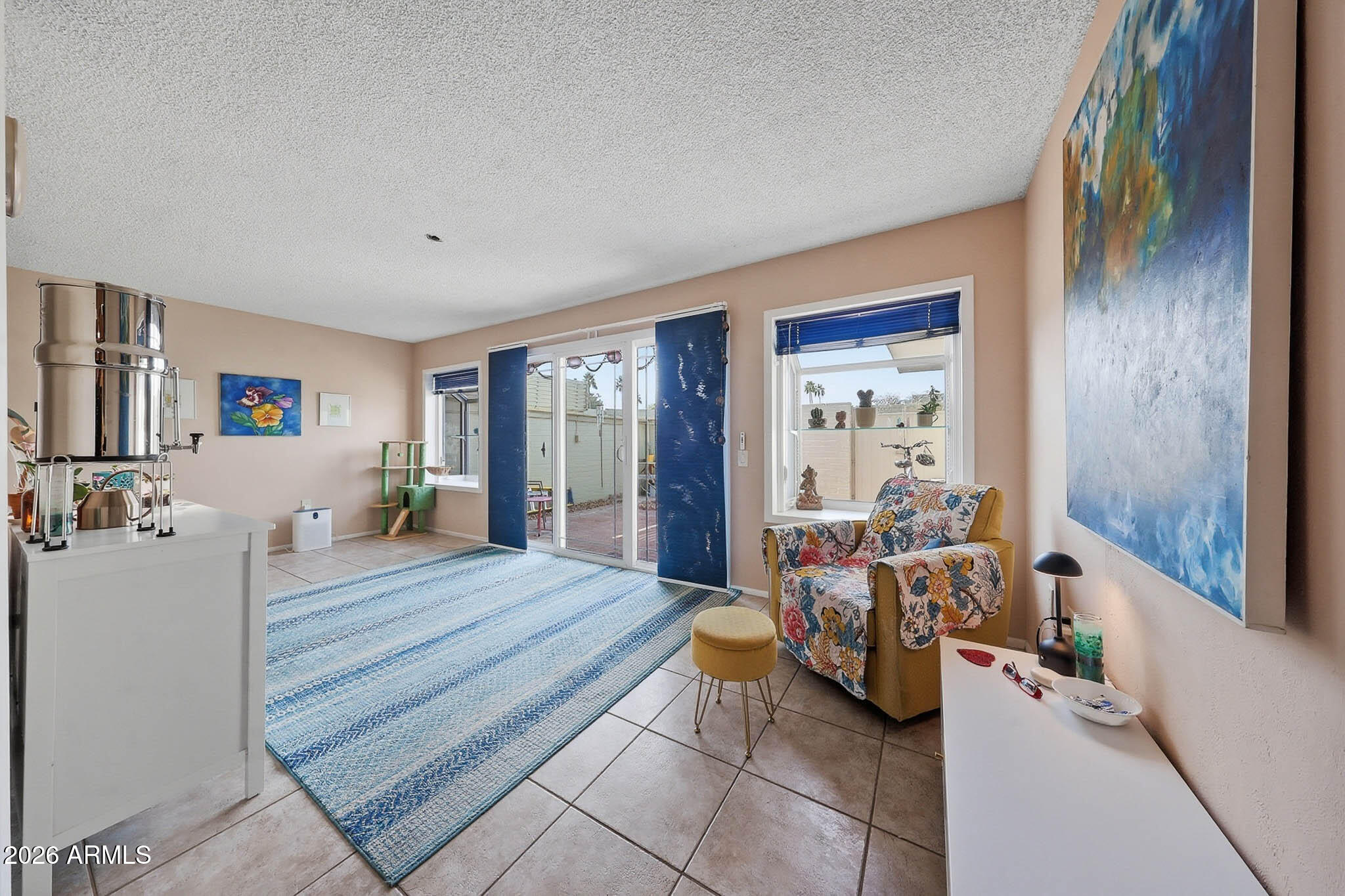 9970 West Royal Oak Road, Unit Q Sun City, AZ 85351 - Photo 3 of 38 a room with a bed and wooden floor