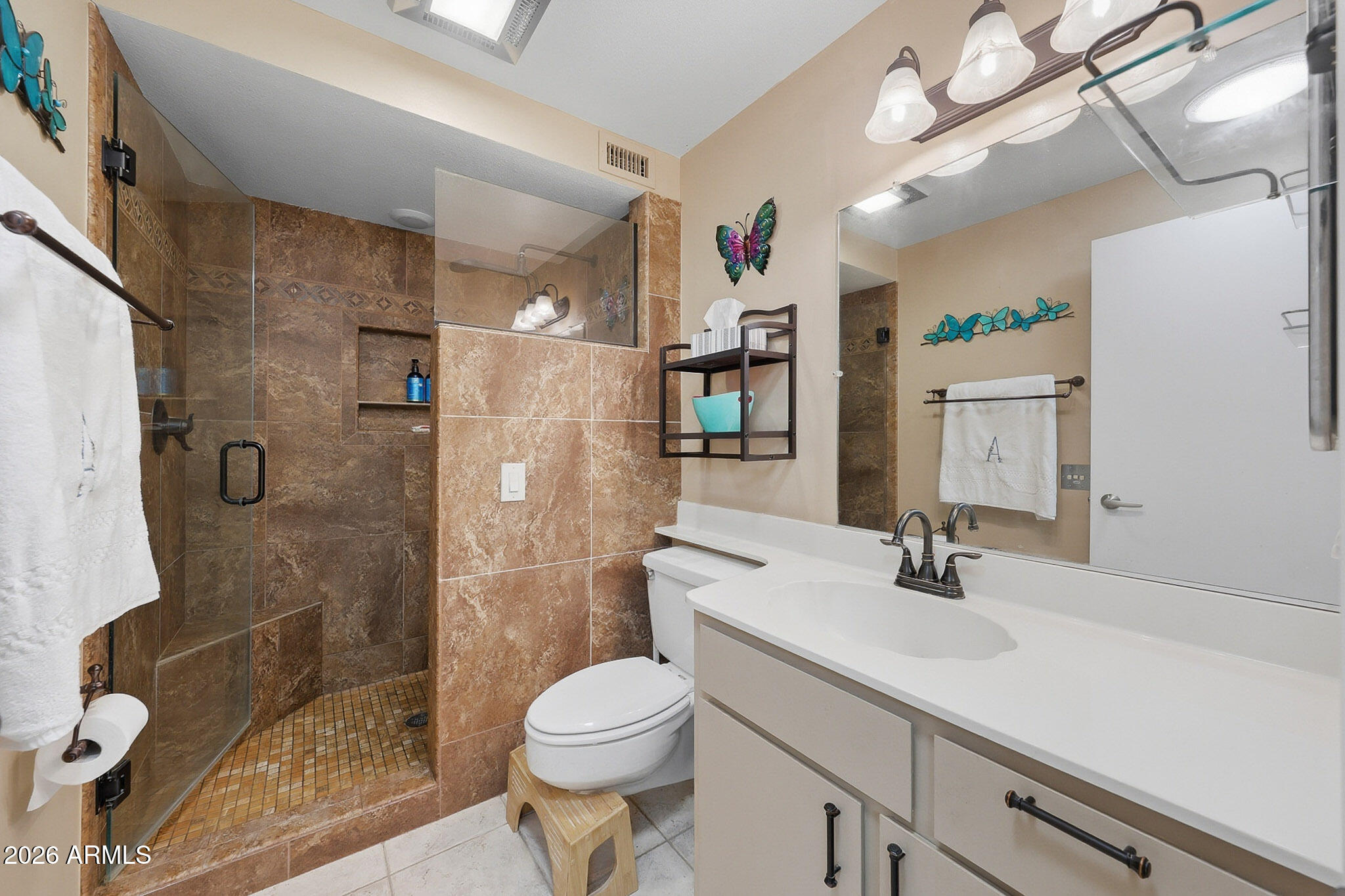9970 West Royal Oak Road, Unit Q Sun City, AZ 85351 - Photo 4 of 38 a bathroom with a sink toilet and shower