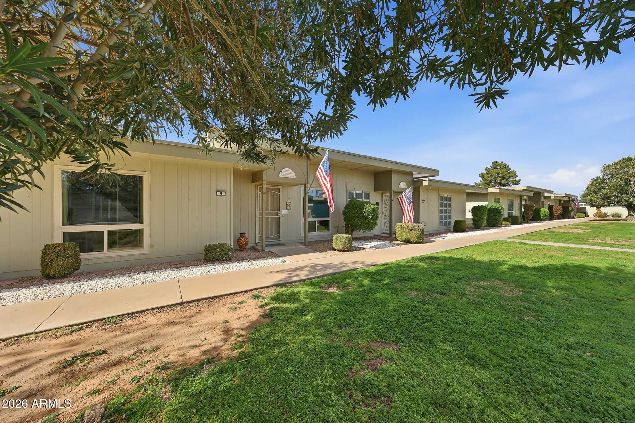 9970 West Royal Oak Road, Unit Q Sun City, AZ 85351 - Photo 9 of 38 a front view of house with yard and green space