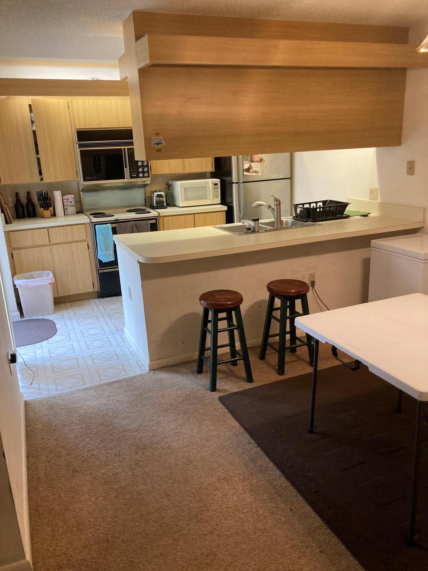 1525 15th Court Jupiter, FL 33477 - Photo 3 of 11 1525 15th ct kitchen 10,13,22