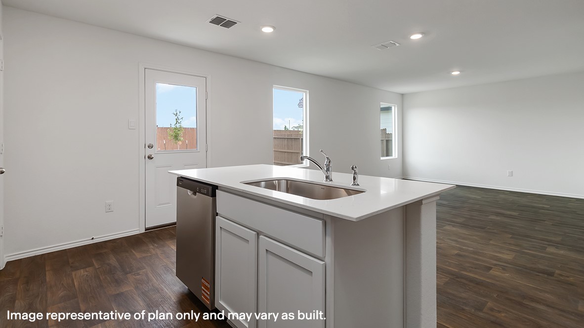 136 Wyatt Way Jarrell, TX 76537 - Photo 10 of 26 a kitchen with a sink cabinets and wooden floor