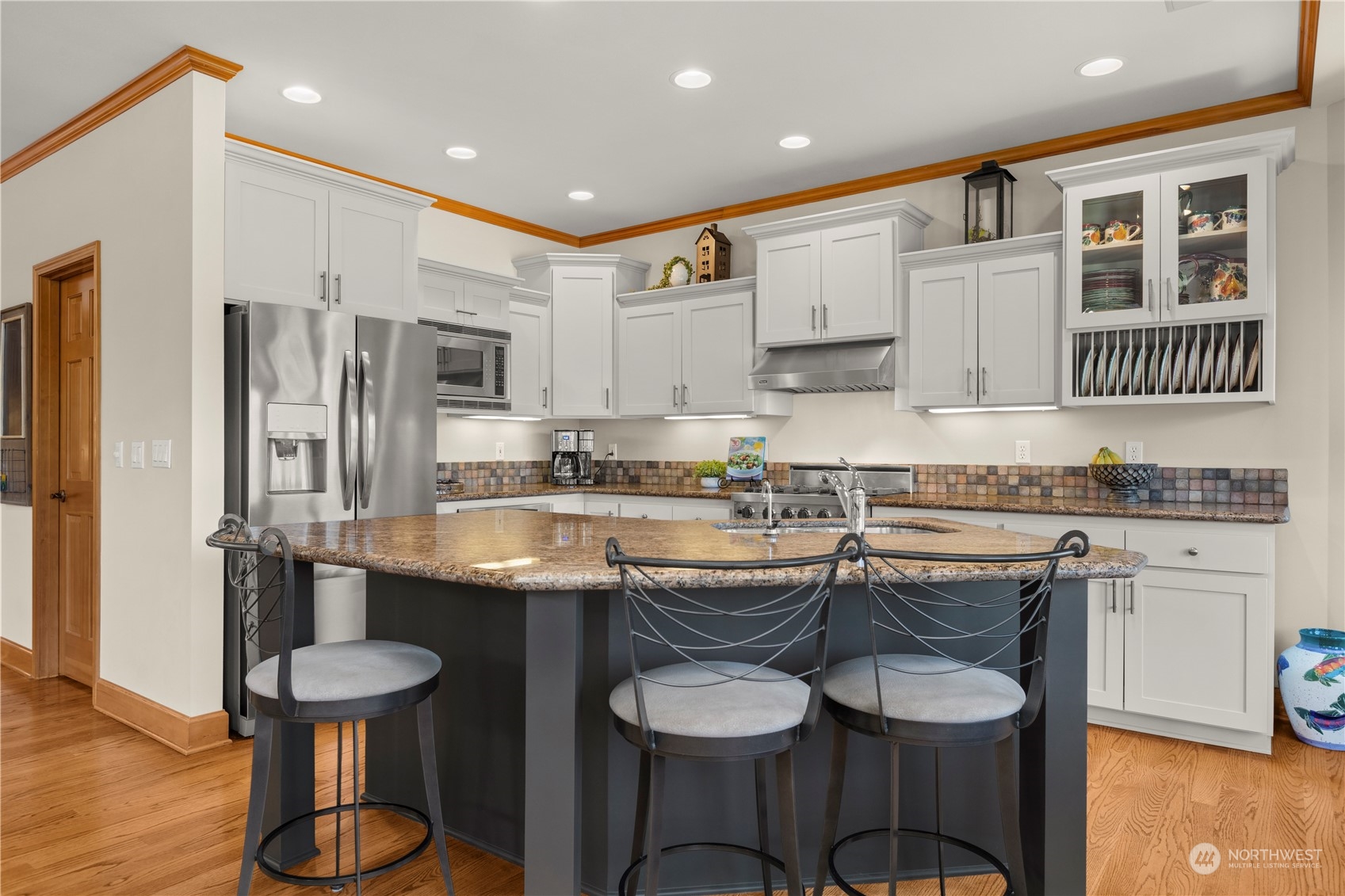 7805 Lake Alice Road Southeast Fall City, WA 98024 - Photo 12 of 32 a kitchen with stainless steel appliances granite countertop a sink and a refrigerator
