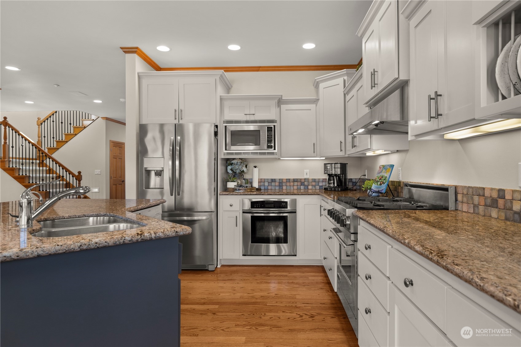 7805 Lake Alice Road Southeast Fall City, WA 98024 - Photo 13 of 32 a kitchen with stainless steel appliances granite countertop a sink stove and refrigerator