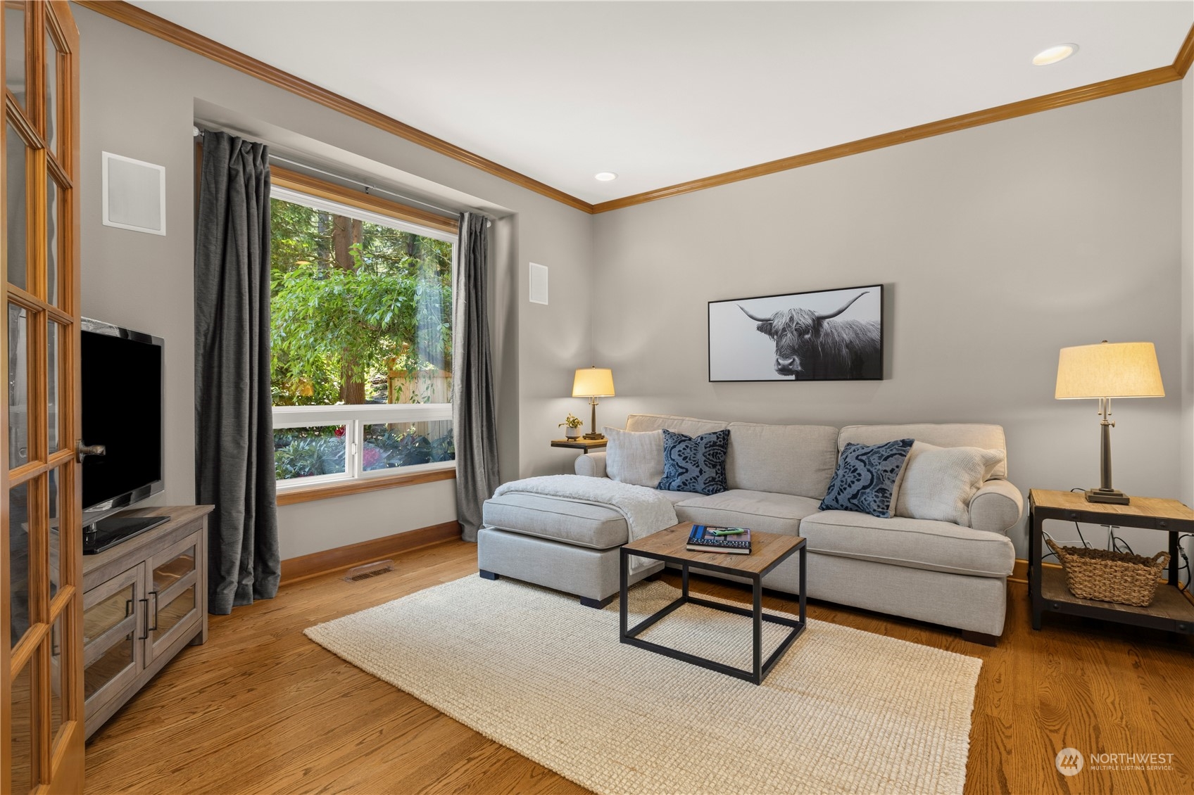 7805 Lake Alice Road Southeast Fall City, WA 98024 - Photo 14 of 32 a living room with furniture and a flat screen tv