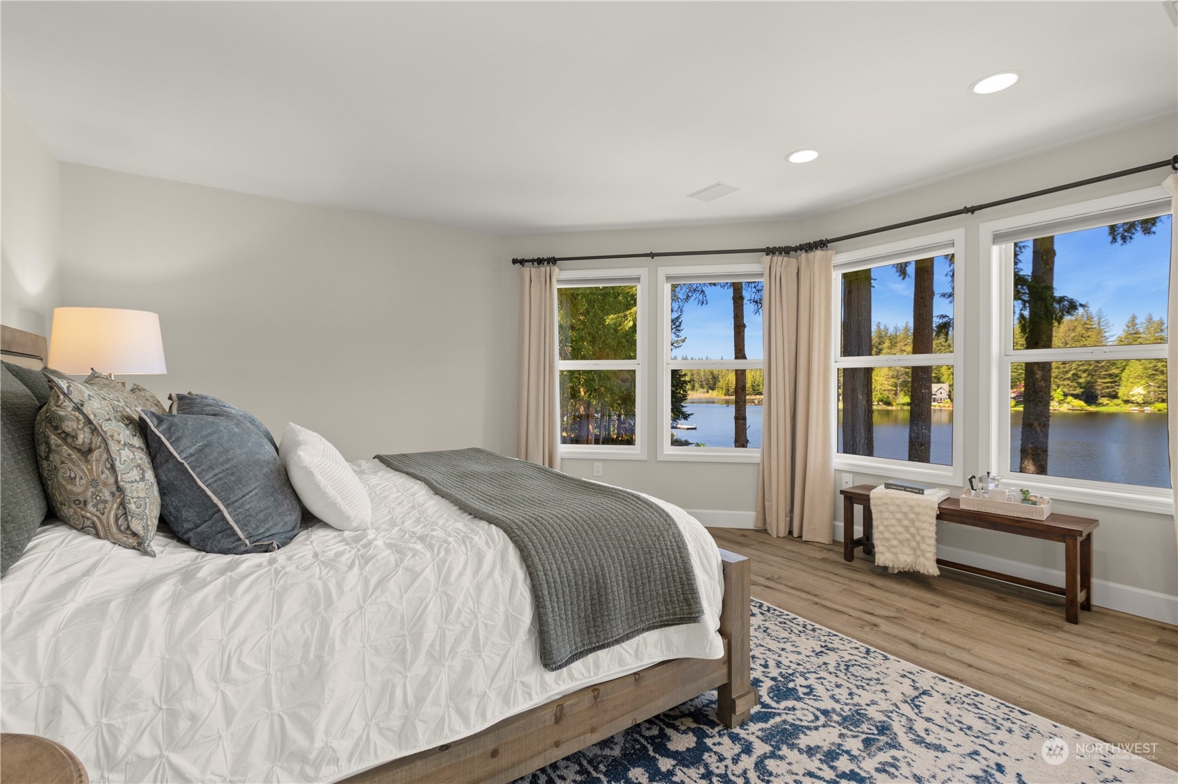 7805 Lake Alice Road Southeast Fall City, WA 98024 - Photo 16 of 32 a bedroom with a large bed and a window