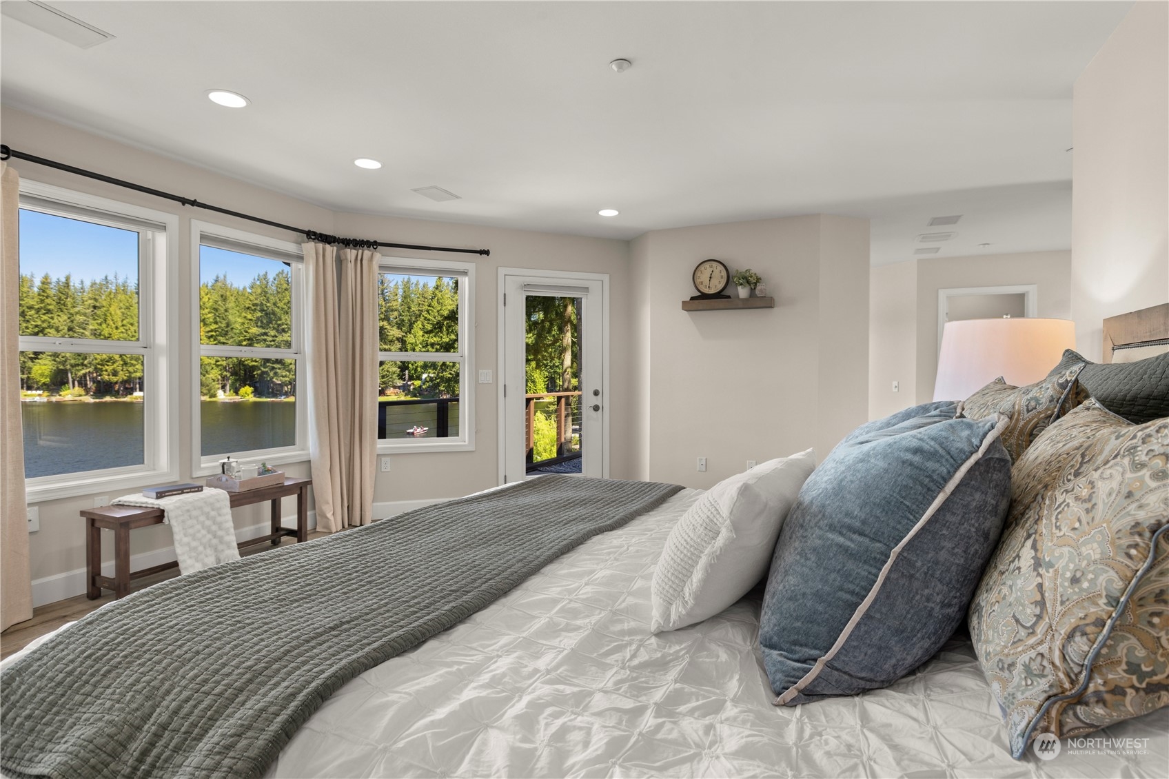 7805 Lake Alice Road Southeast Fall City, WA 98024 - Photo 17 of 32 a bedroom with a large bed and a large window