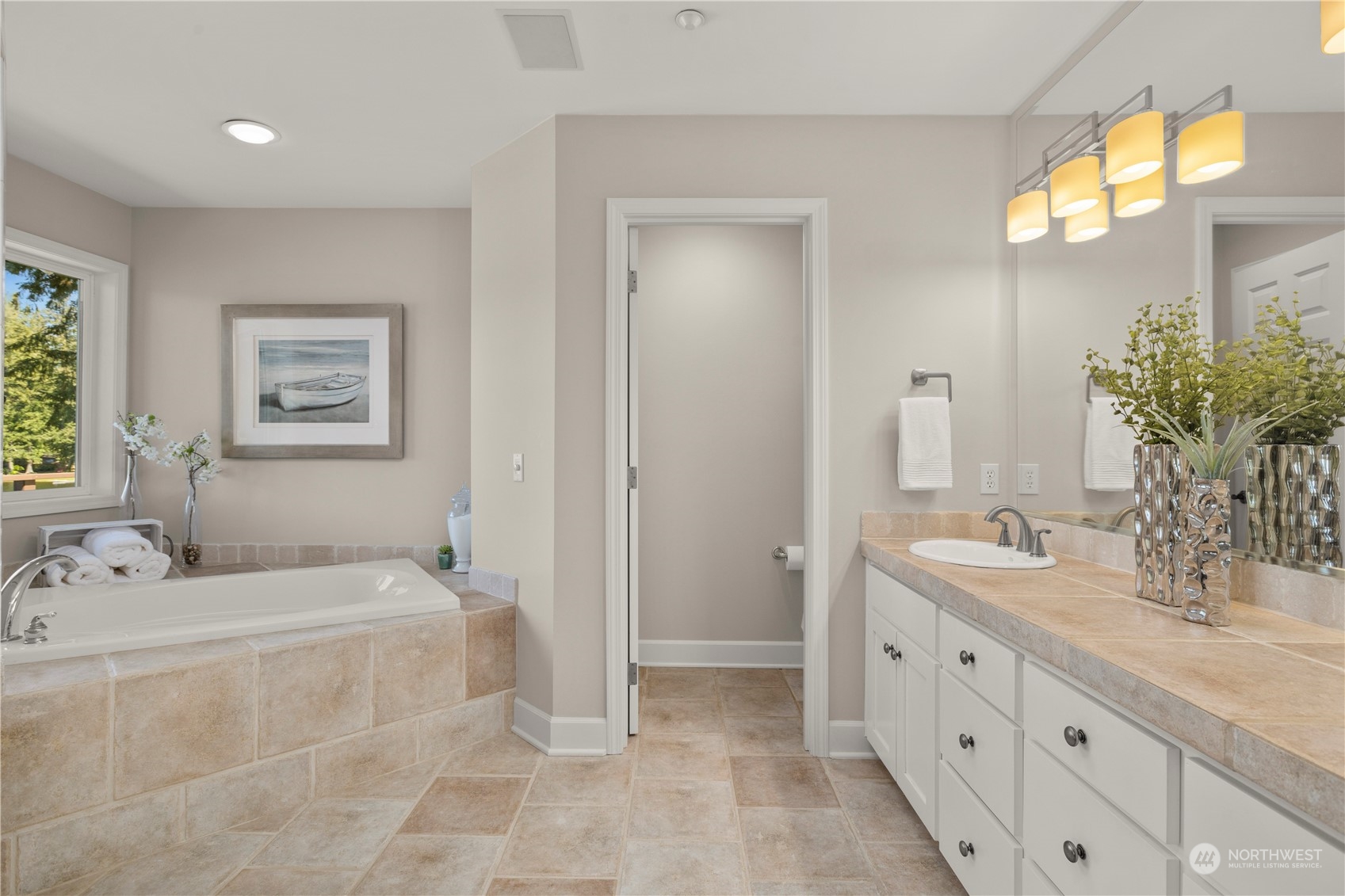 7805 Lake Alice Road Southeast Fall City, WA 98024 - Photo 18 of 32 a bathroom with a double vanity sink mirror and a bathtub
