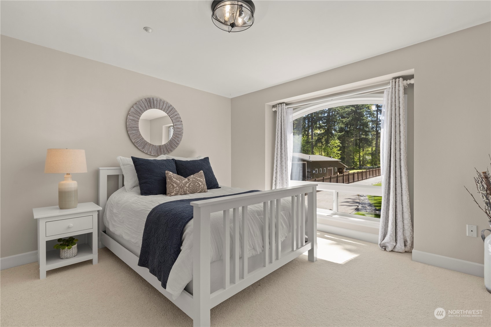 7805 Lake Alice Road Southeast Fall City, WA 98024 - Photo 20 of 32 a bedroom with a bed and a window