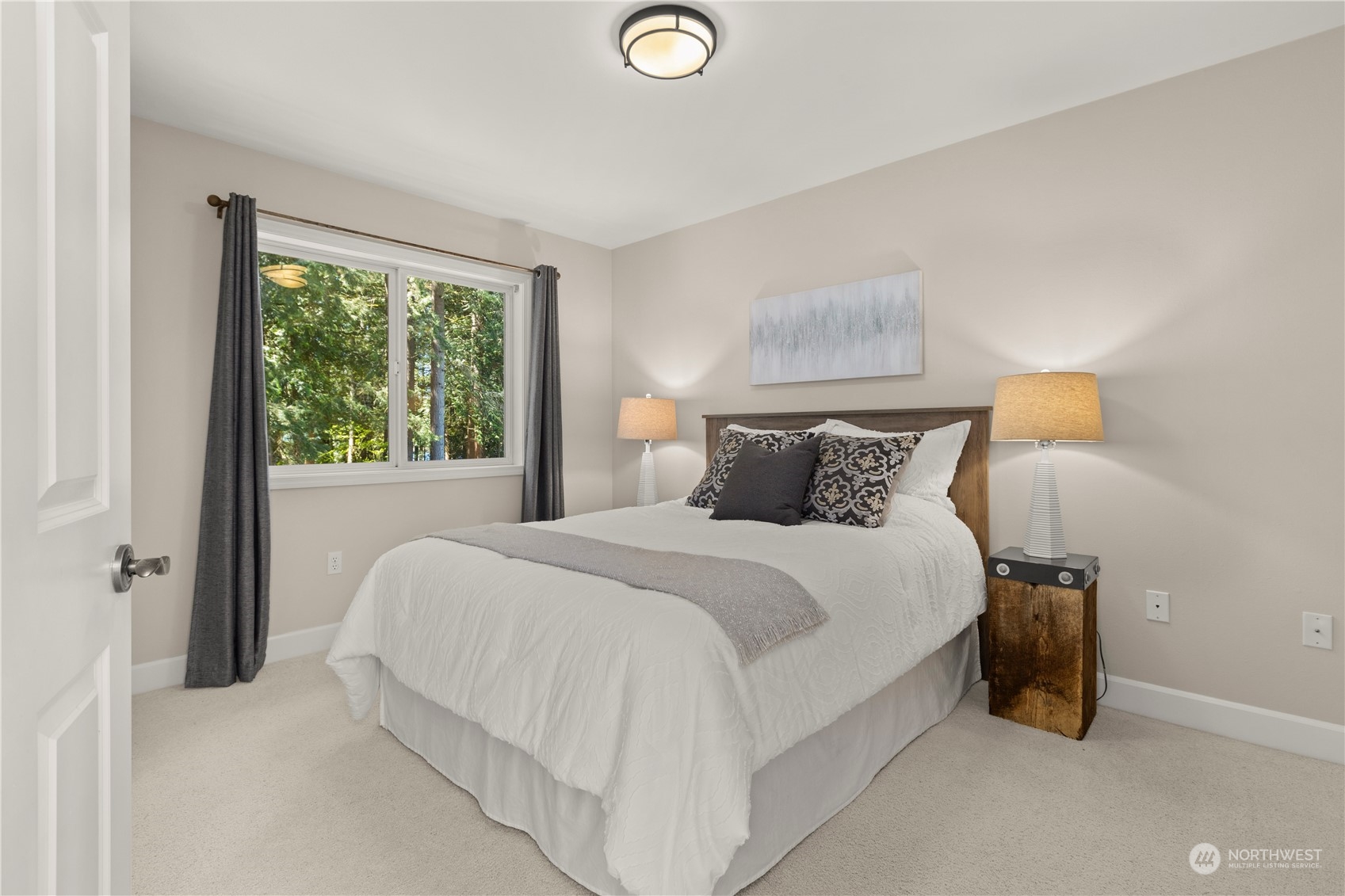 7805 Lake Alice Road Southeast Fall City, WA 98024 - Photo 22 of 32 a bedroom with a bed and window