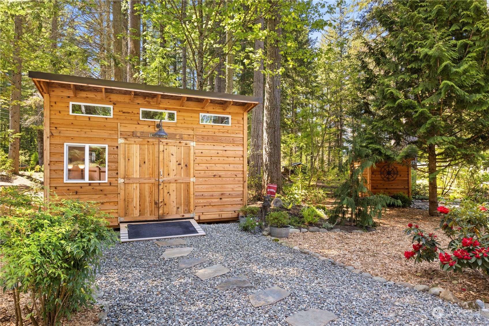 7805 Lake Alice Road Southeast Fall City, WA 98024 - Photo 25 of 32 a view of a house with a backyard