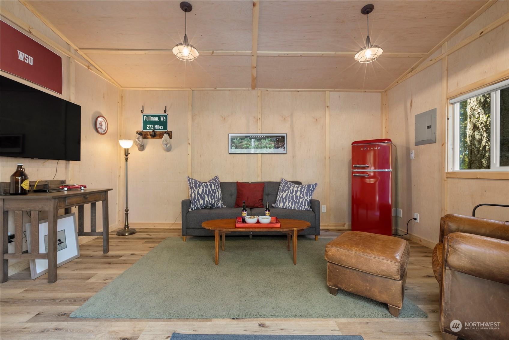 7805 Lake Alice Road Southeast Fall City, WA 98024 - Photo 26 of 32 a living room with furniture and a flat screen tv
