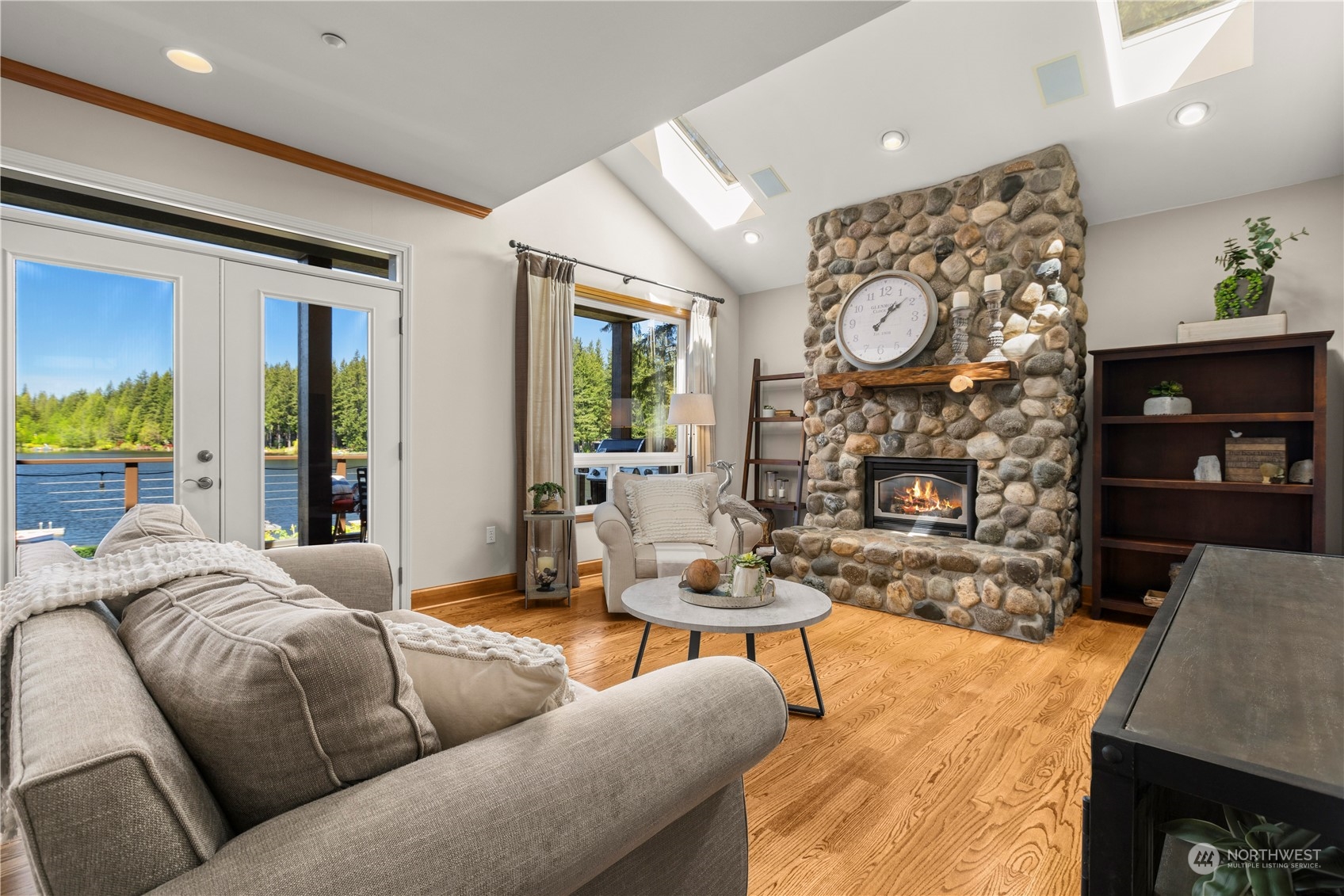 7805 Lake Alice Road Southeast Fall City, WA 98024 - Photo 5 of 32 a living room with fireplace furniture and a wooden floor