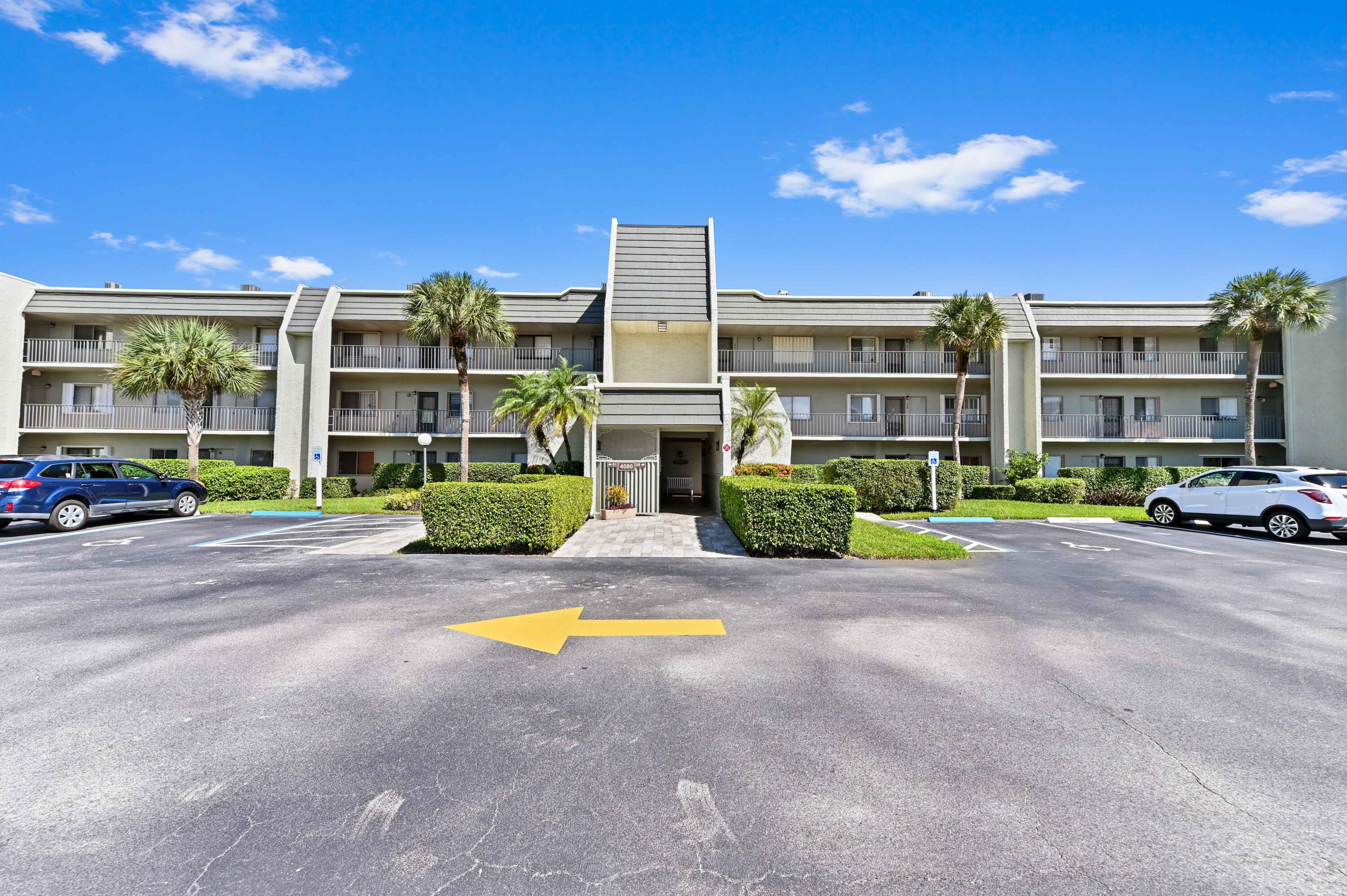 4080 Tivoli Court, Unit 202 Lake Worth, FL 33467 - Photo 1 of 28 a view of a building with a street