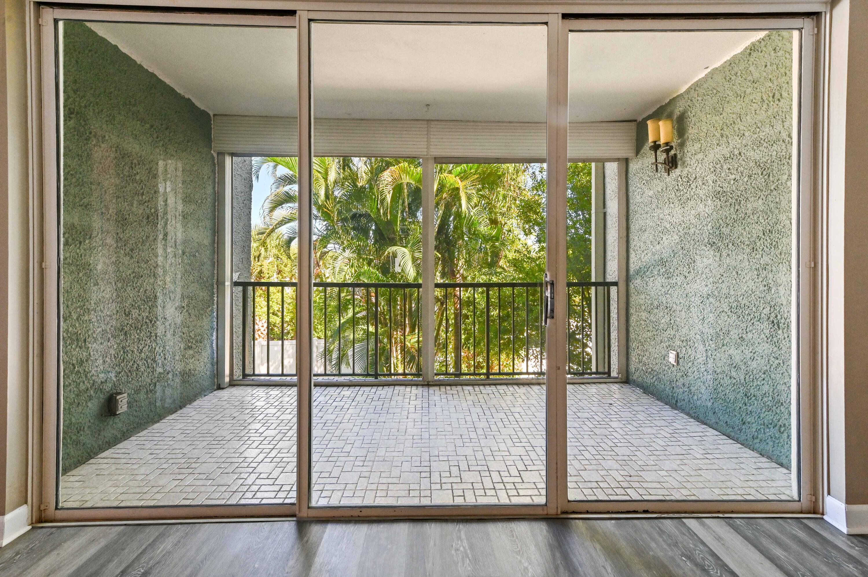 4080 Tivoli Court, Unit 202 Lake Worth, FL 33467 - Photo 11 of 28 a view of a glass door