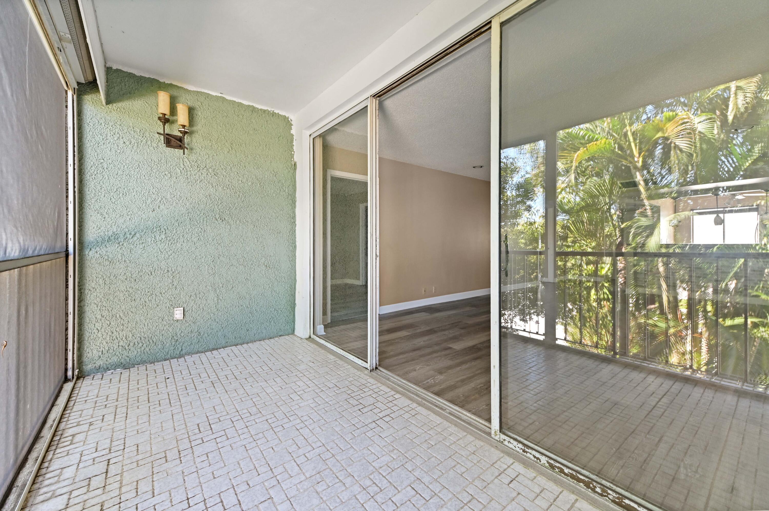 4080 Tivoli Court, Unit 202 Lake Worth, FL 33467 - Photo 12 of 28 a view of a bathroom with a glass door