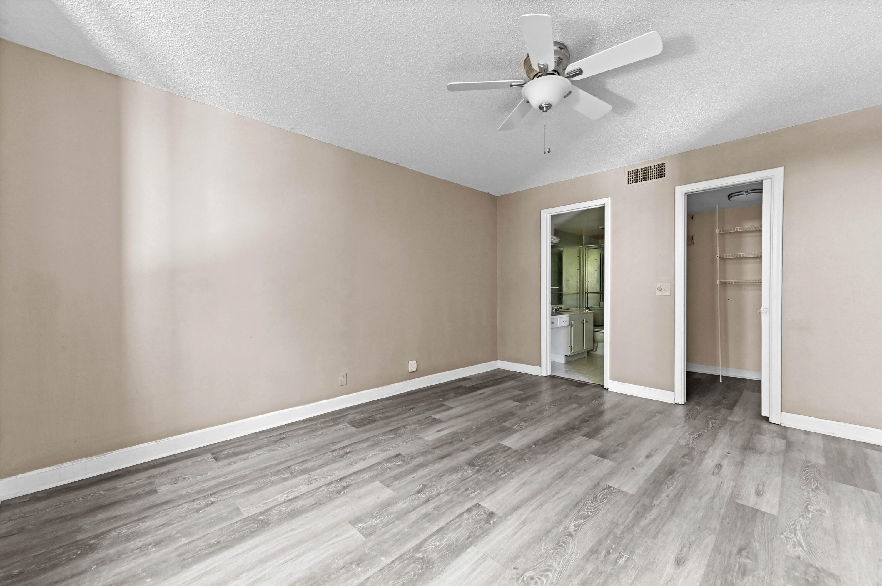 4080 Tivoli Court, Unit 202 Lake Worth, FL 33467 - Photo 15 of 28 a view of an empty room with wooden floor