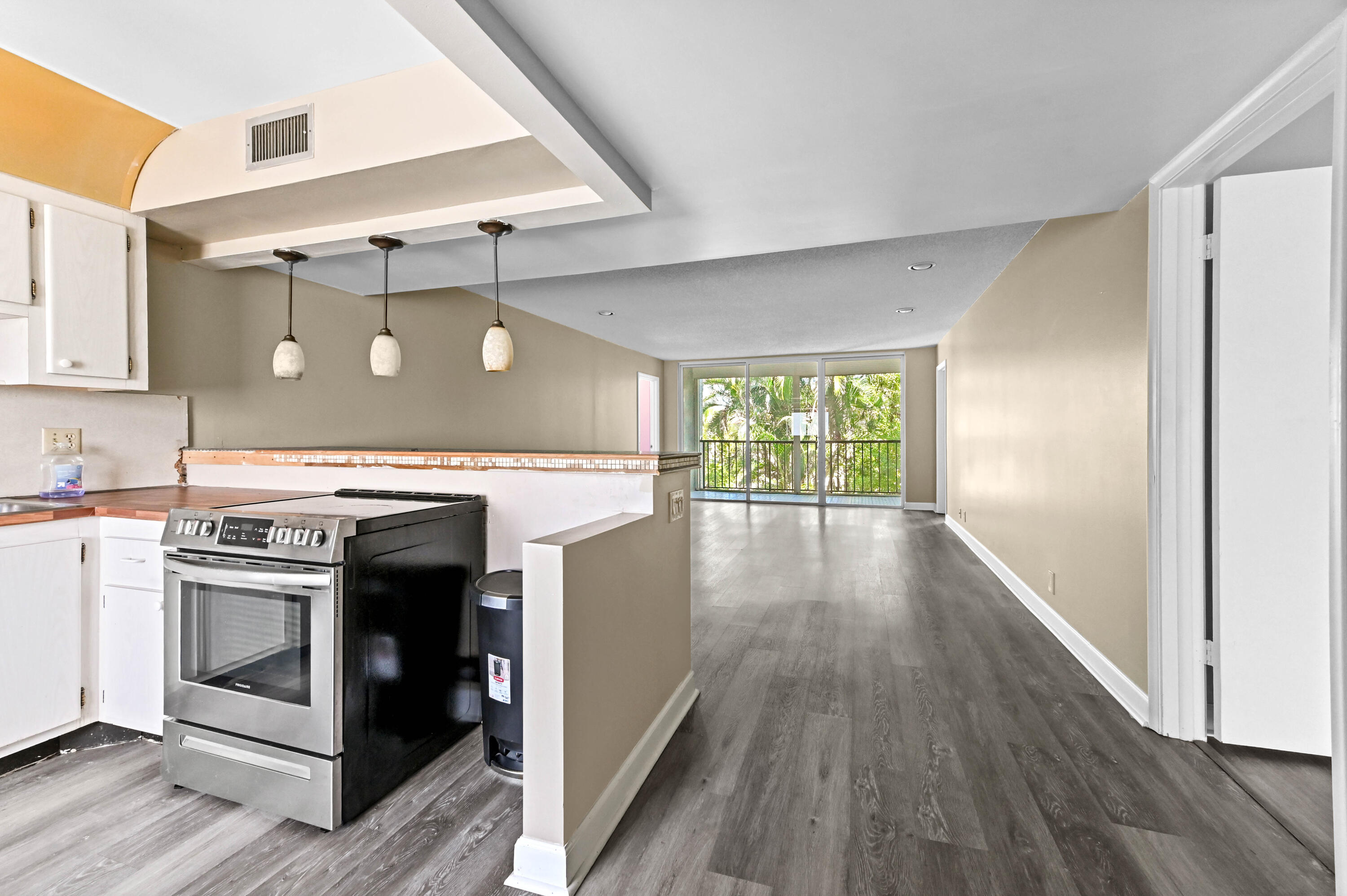 4080 Tivoli Court, Unit 202 Lake Worth, FL 33467 - Photo 2 of 28 a kitchen with a stove top oven and sink