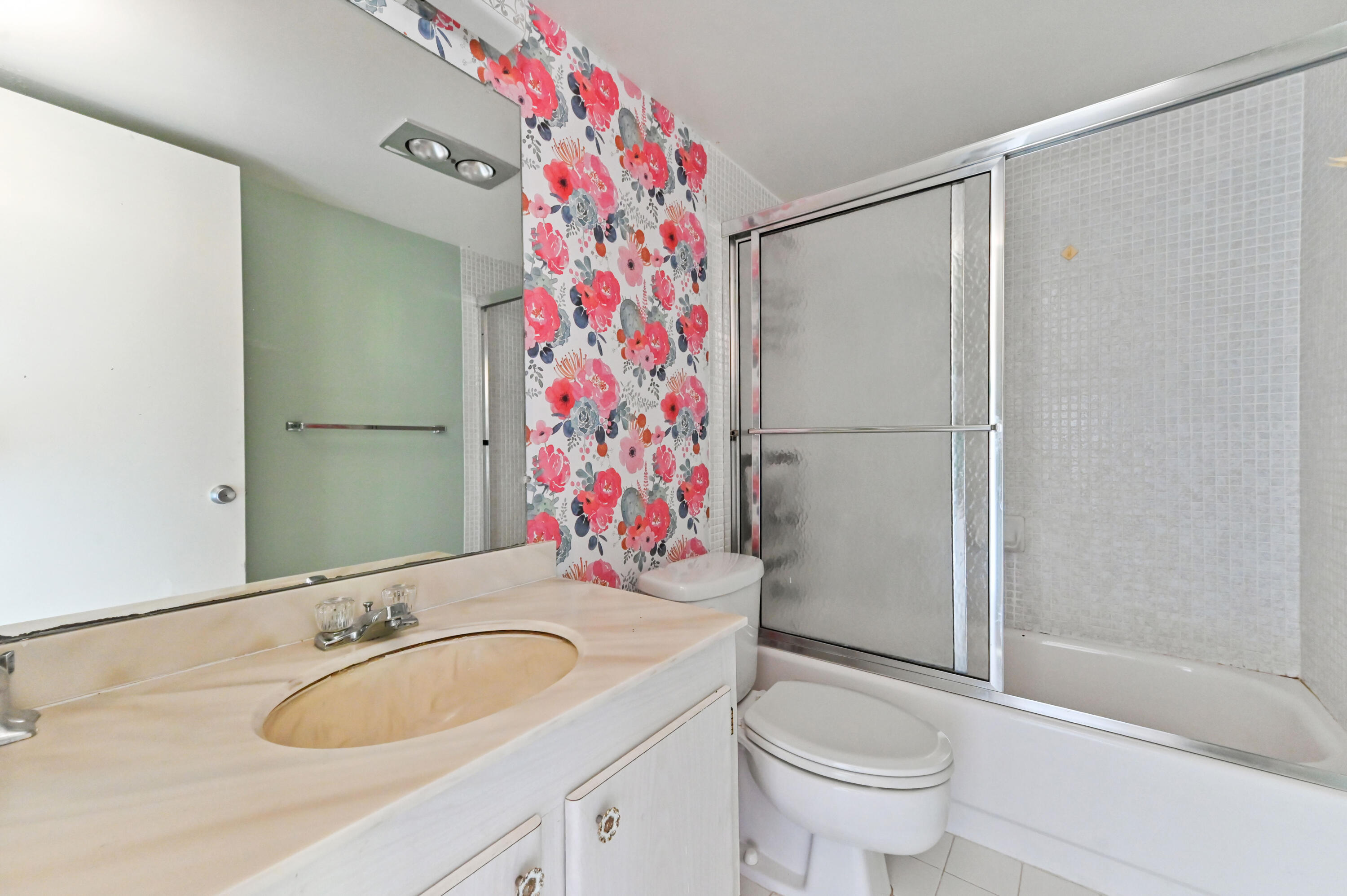 4080 Tivoli Court, Unit 202 Lake Worth, FL 33467 - Photo 24 of 28 a bathroom with a sink toilet and shower